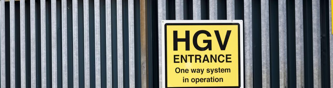 fence with hgv entrance sign
